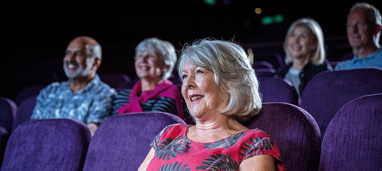 Guests enjoying a show in the Playhouse on Spirit of Adventure